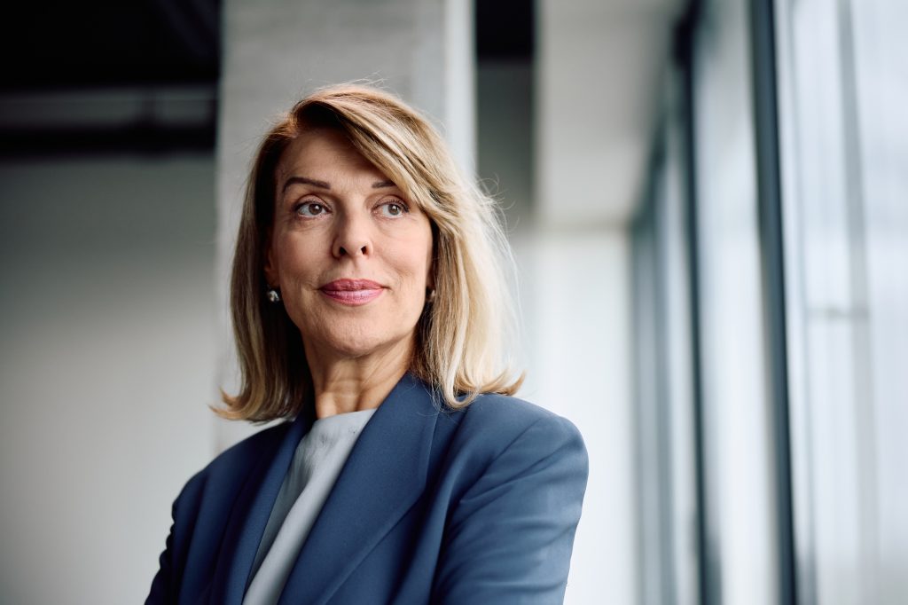 Mature female CEO in the office looking away,