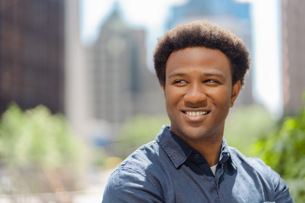 Portrait of handsome business man CEO looking away while standing