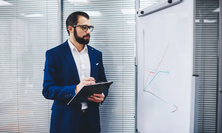 experienced businessman checking revenue marketing diagram